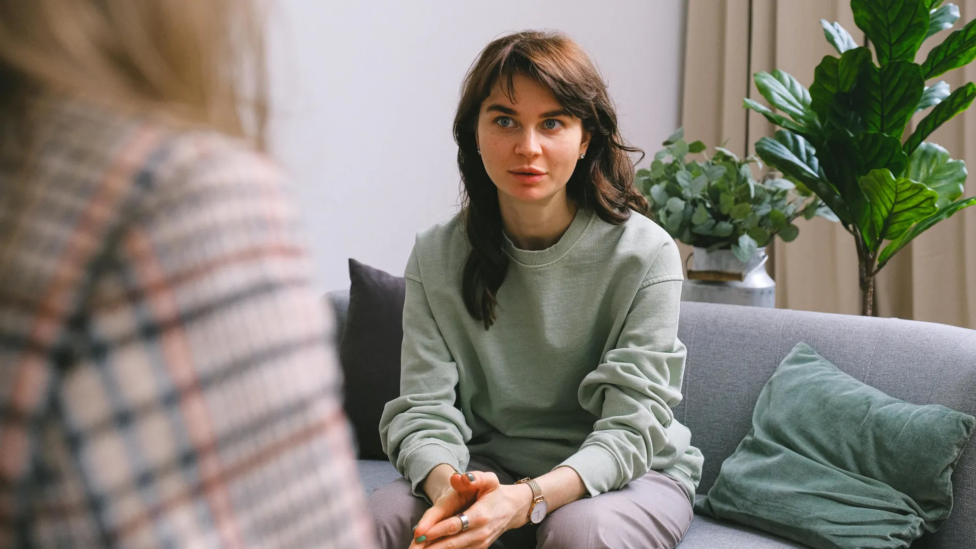 A young woman is going through EMDR with her counsellor.