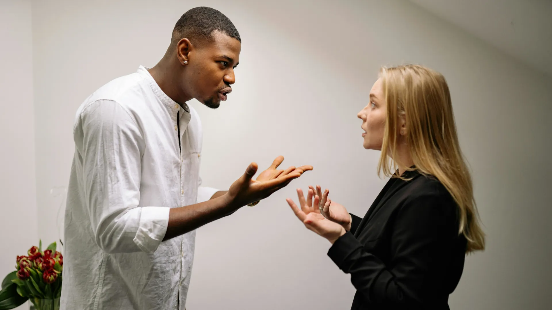 A young couple argue over their relationship differences.