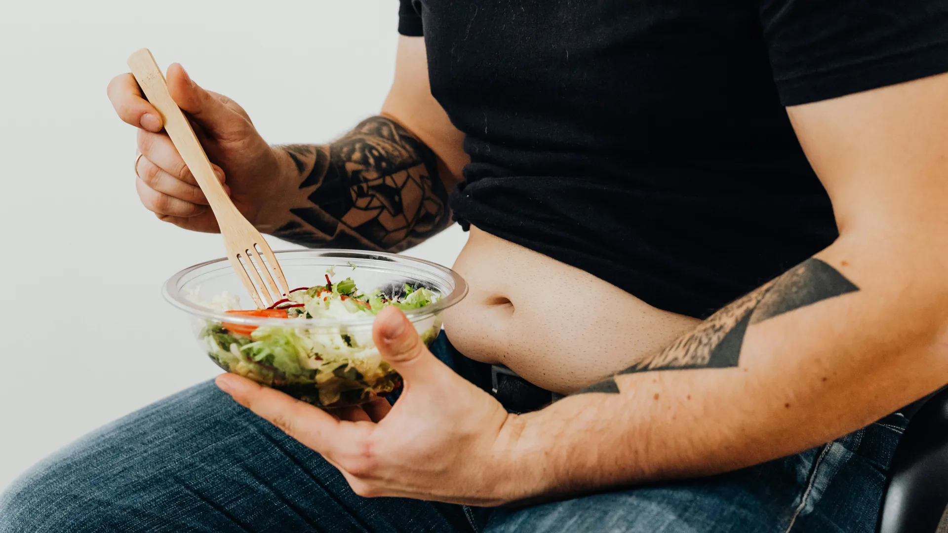 A young obese male is deciding to make healthy eating changes as part of his weight loss treatment.